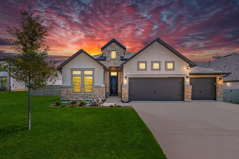 Front of a modern home at sunset