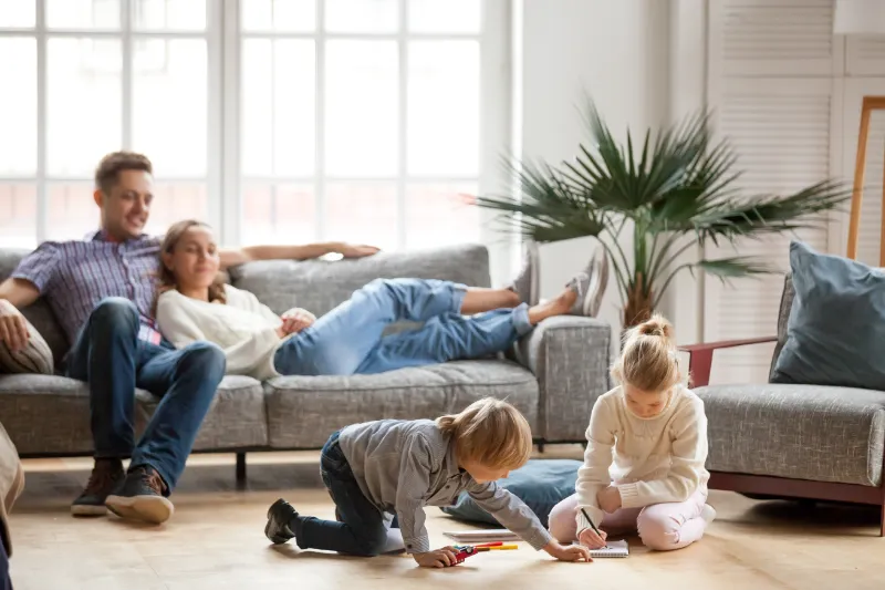 Family together in a living room