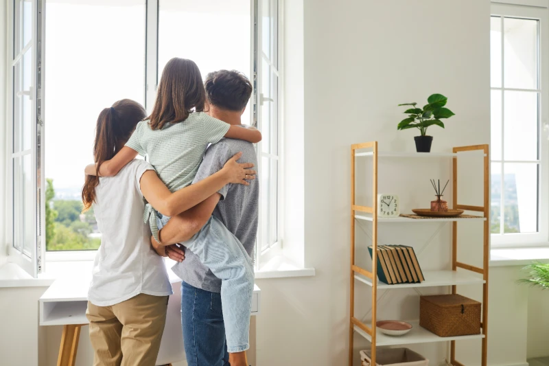 Family looking out window